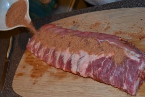 Rubbing the spices into the ribs