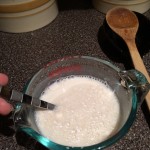 Slowly mixing together the milk and flour