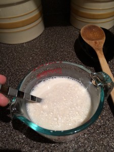 Slowly mixing together the milk and the flour